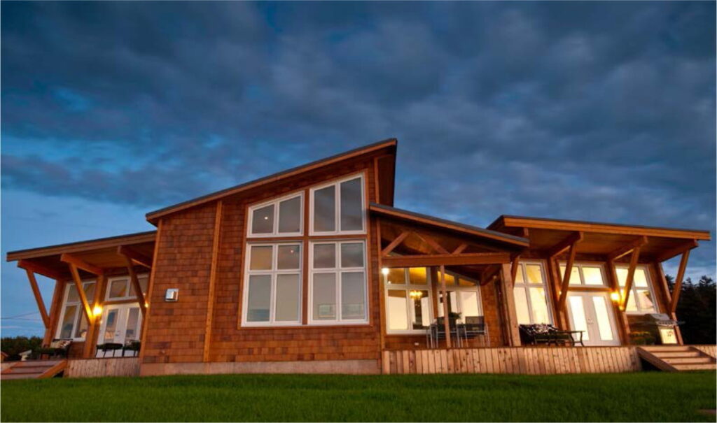 A house with a large window and wooden roof.